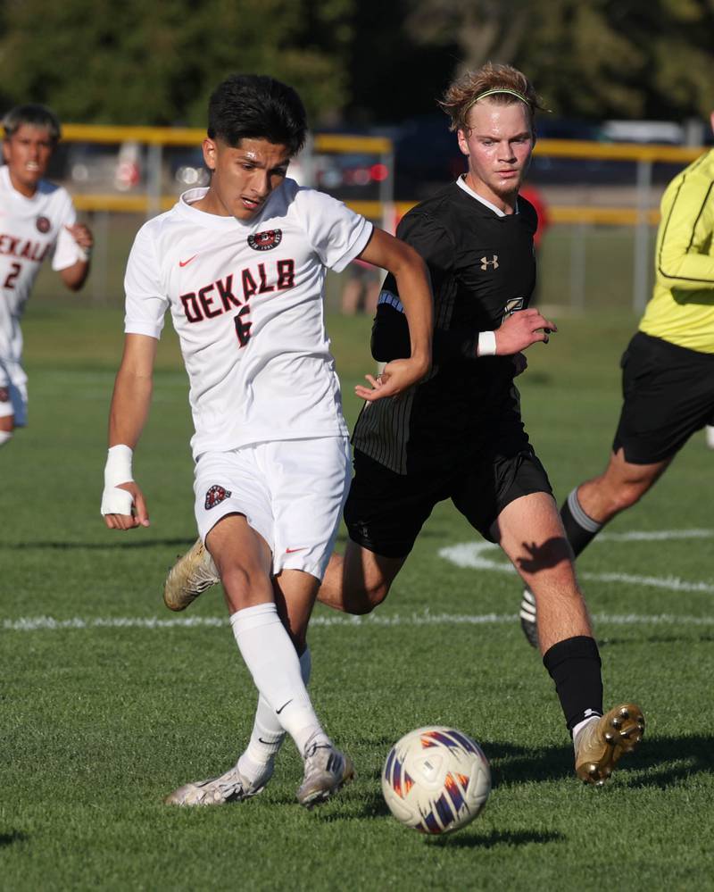 DeKalb's Mauricio Jasso passes the ball in front of Sycamore's Aiden Sears during the El Classicorn rivalry game Tuesday, Oct. 7, 2025, at Sycamore High School.