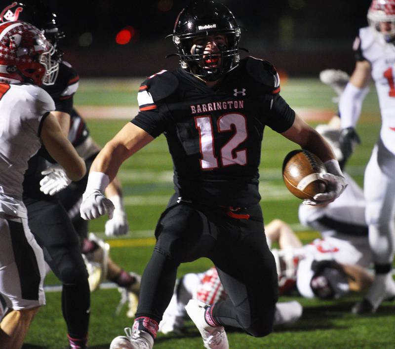 Joe Lewnard/jlewnard@dailyherald.com
Barrington’s Dillon Fitzpatrick carries the ball into the end zone for a second-quarter touchdown during the Class 8A football quarterfinal game against Maine South Saturday.