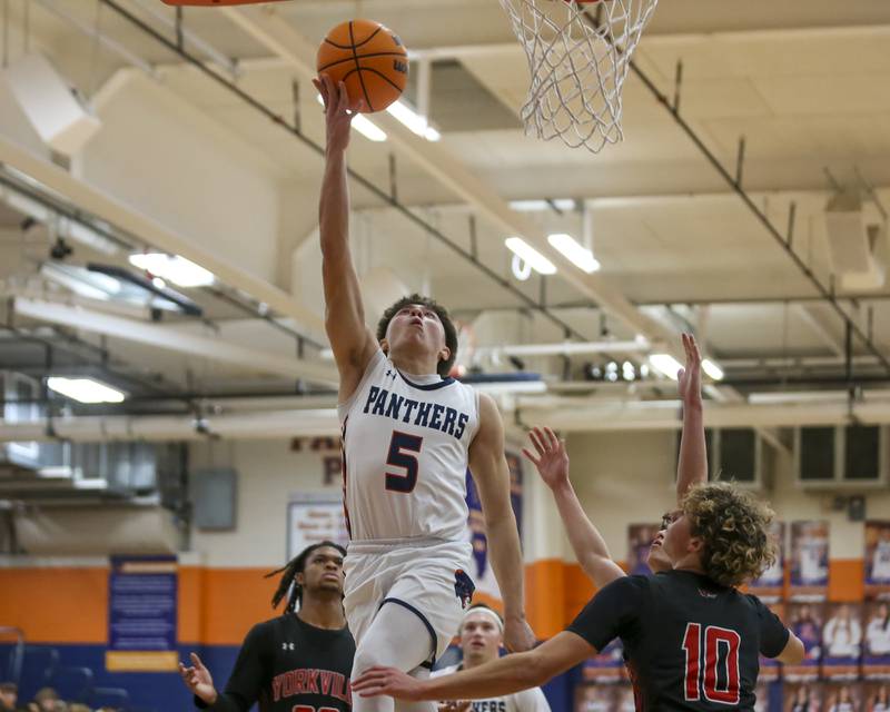 Oswego's Mariano Velasco (5) goes in for a lay up during their basketball game between Yorkville at Oswego, Feb 7, 2026 in Oswego.