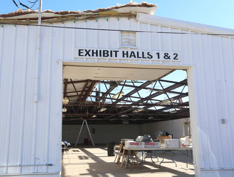 Crews from Vitale Construction work on replacing the roof of the exterior of the Exhibit Hall's 1 and 2 building on Wednesday, Nov. 8, 2023 at the Bureau County Fairgrounds in Princeton.