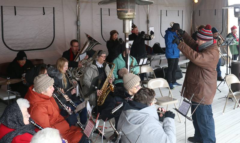 The Peru Municipal Band plays the Natioinal Anthem during the 46th annual Peal Harbor parade and Memorial service at the South Shore Boat Club in Peru.