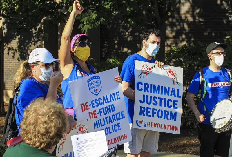 Advocates for change in the Joliet Police Department demonstrate outside Joliet City Hall in July.