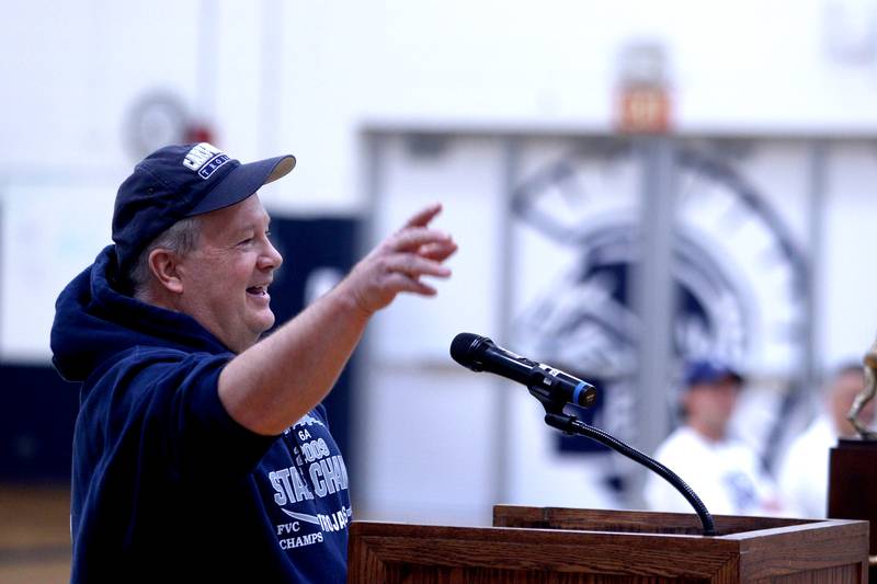 Trout Valley President Bob Baker speaks during a celebration of the IHSA Class 6A Champion Cary-Grove football team at the high school Sunday.