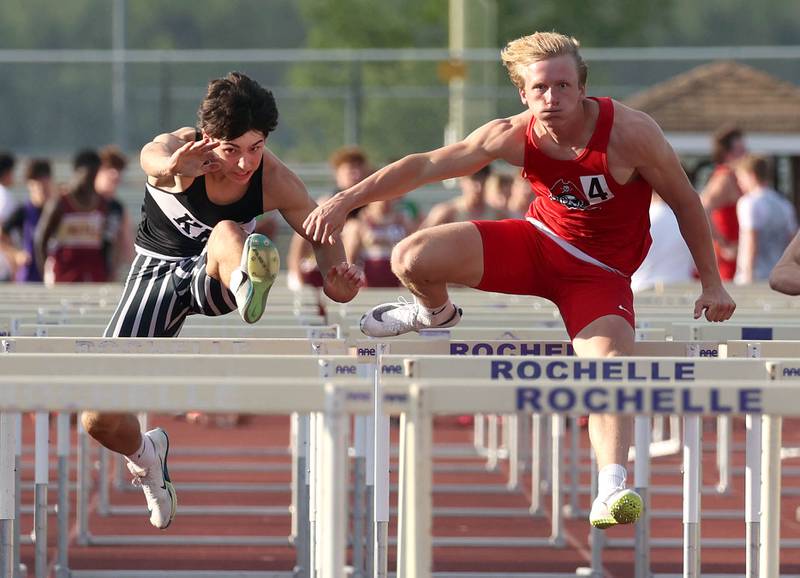 Kaneland’s Luke Gadomski clears a hurdle on his way to second place, just behind Ottawa’s Weston Averkamp in the 110 meter hurdles Tuesday, May 13, 2025, during the Interstate 8 Conference boys track championships at Rochelle High School.