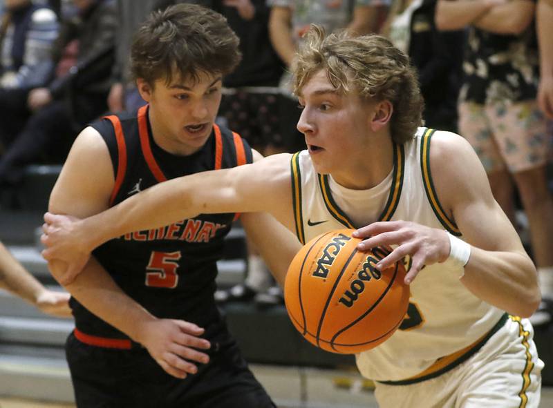 Crystal Lake South's Carson Trivellini tries to drive the baseline against McHenry's Kyle Maness during a Fox Valley Conference basketball game on Friday, Jan. 31, 2025, at Crystal Lake South High School.