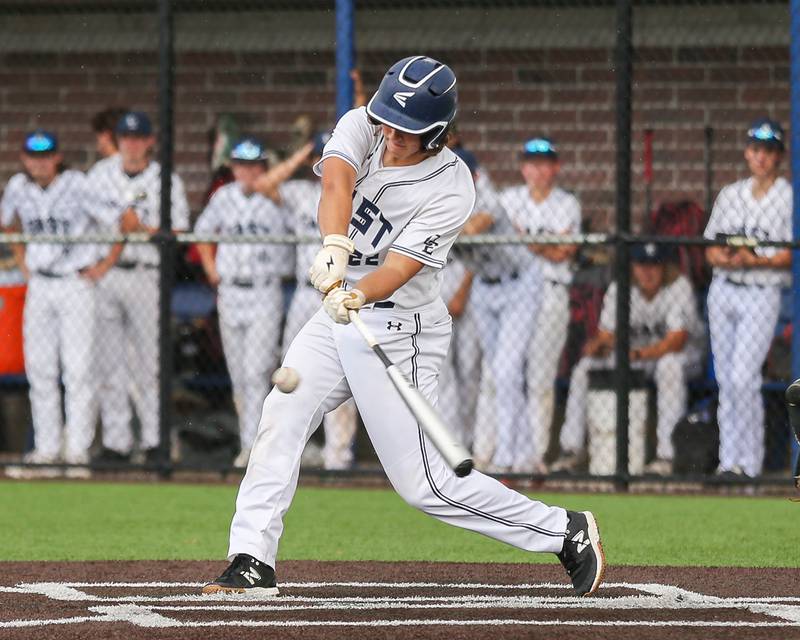 Oswego East's Jackson Petsche (22) swings at a pitch during Class 4A Romeoville Sectional semifinal between Oswego East at Downers Grove North.  May 31, 2023.
