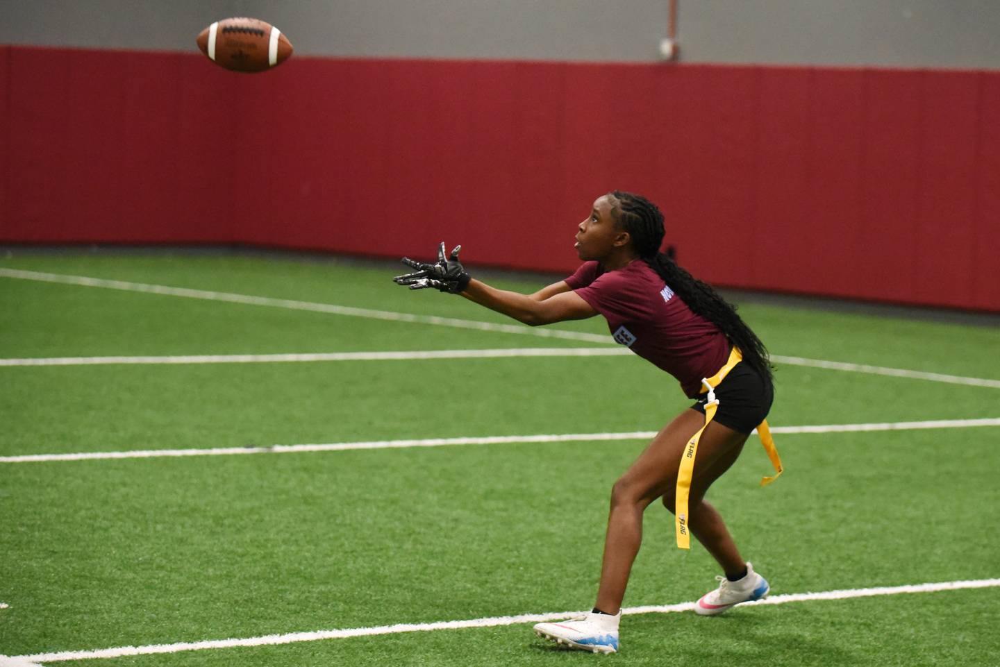 Kankakee's Jasiah Hawkins looks to haul in a pass during flag football practice Wednesday, Aug. 13, 2025.