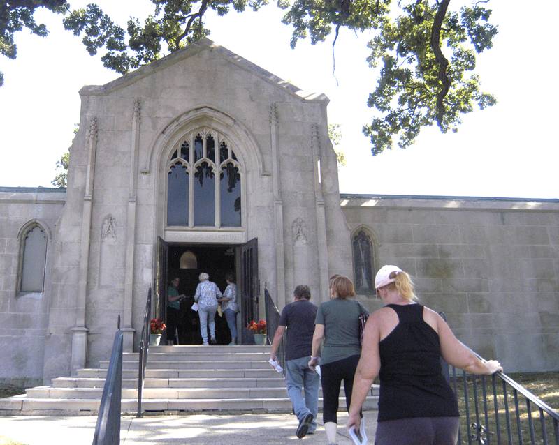 Visitors climb the mausoleum steps at Oakwood Cemetery in Dixon on Sunday, Sept. 28.