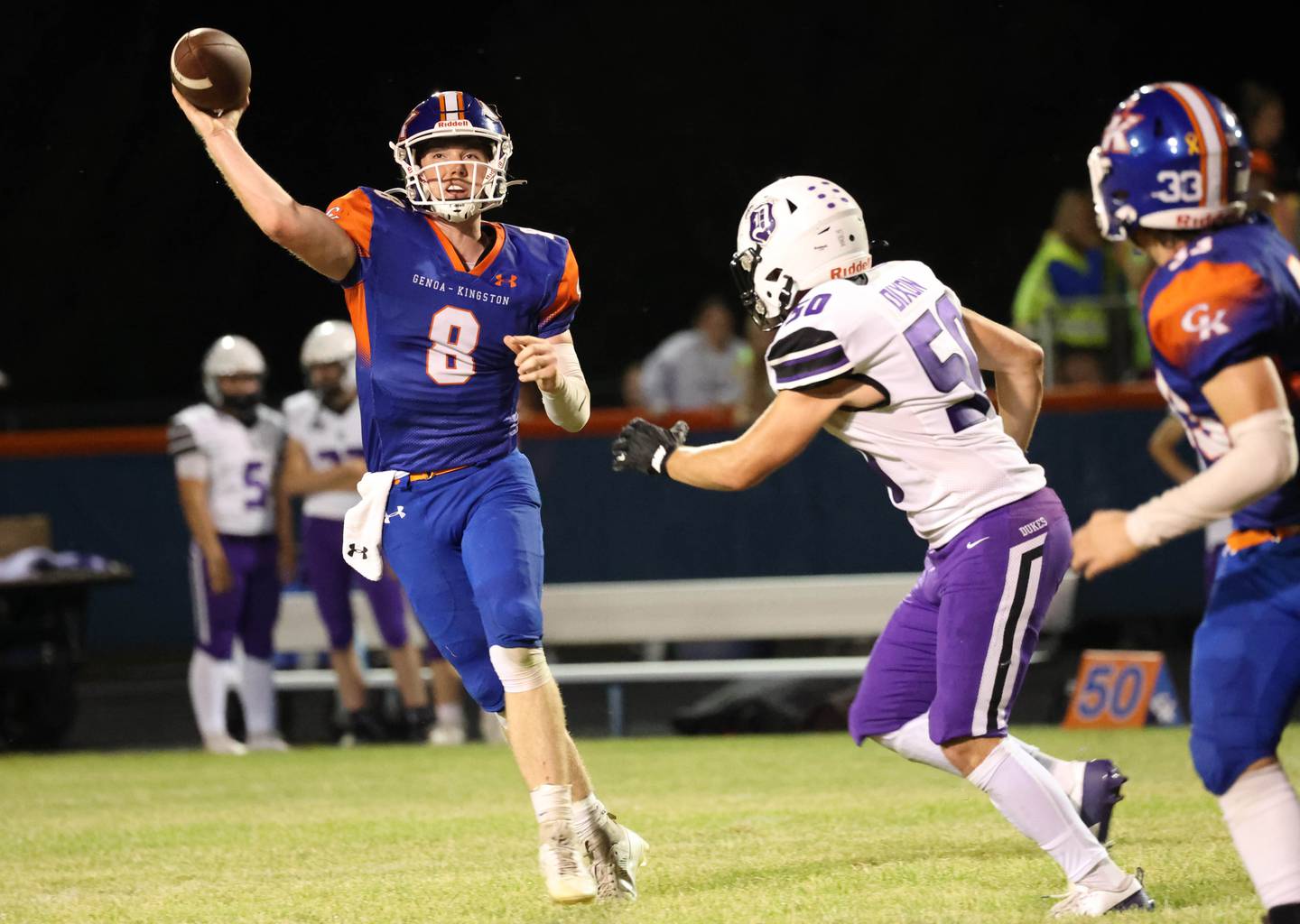 Genoa-Kingston's Nathan Kleba gets rid of the ball just ahead of the pressure of Dixon’s Aidan Hoggard during their game Friday, Sept. 20, 2024, at Genoa-Kingston High School.