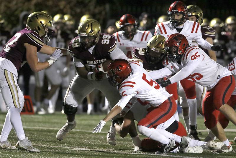 St. Ignatius' Guillermo Tapia breaks away from the Huntley defense to score a touchdown during a IHSA Class 8A second round playoff football game on Friday, Nov. 3, 2023, at St. Ignatius College Prep in Chicago.