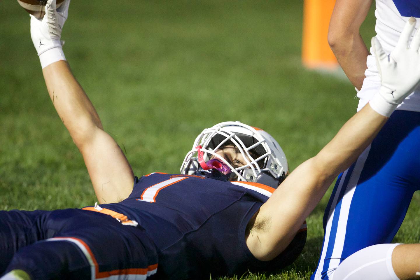 Oswego's Teddy Manikas puts his hands up after scoring a touchdown Friday, Sept. 5, 2025 in Oswego.