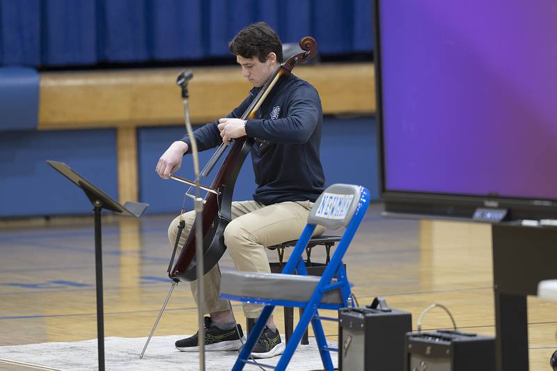 Newman student Zac DeForest plays “My Heart Will Go On” on the cello Thursday, Jan. 30, 2025, during a talent show at the school. NHS held the show in celebration of Catholic Schools Week.