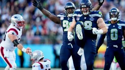 Seahawks ride their ‘Dark Side’ defense to a Super Bowl title, pounding the Patriots 29-13