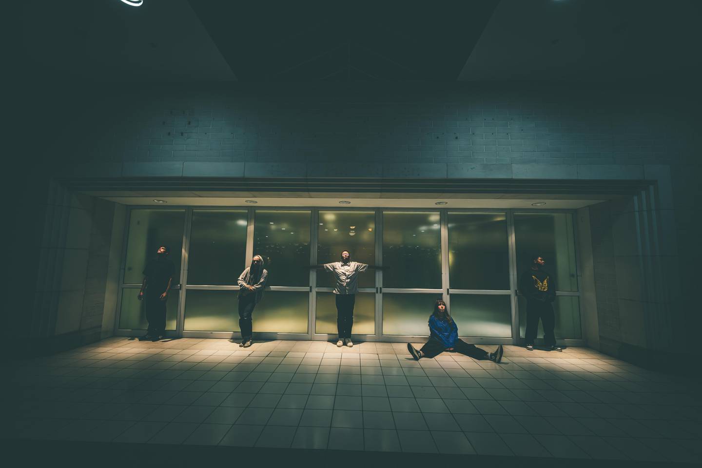 The Boston-based rock band Fleshwater poses for a photo on the set of the music video for their song "Last Escape," which was shot at Northfield Square mall in Bradley.