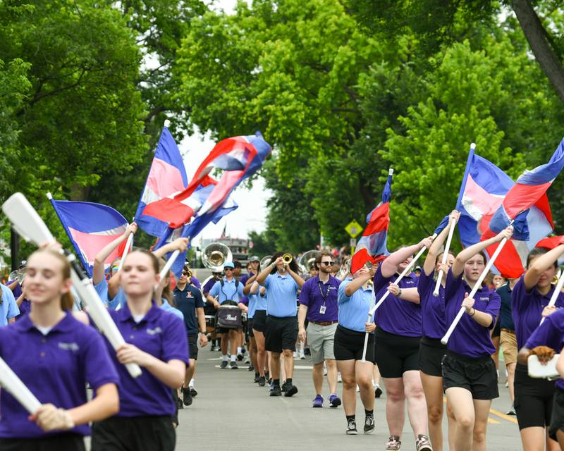 Downers Grove North and Downers Grove South marching band join together during the Independence Day parade on Friday July 4, 2025, held in downtown Downers Grove.