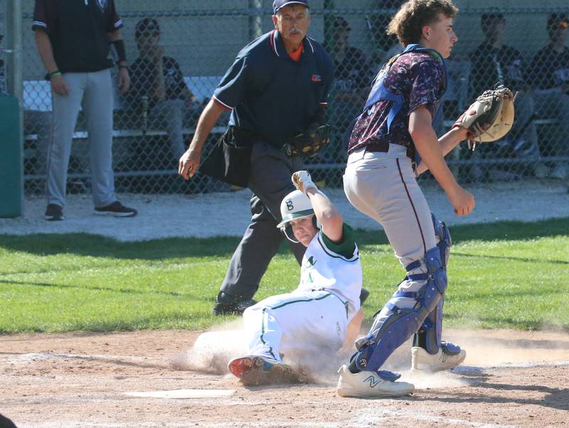 St. Bede's Geno Dinges slides safely into home against Princeville during the Class 1A Regional semifinal game on Friday, May 17, 2024 at St. Bede Academy.