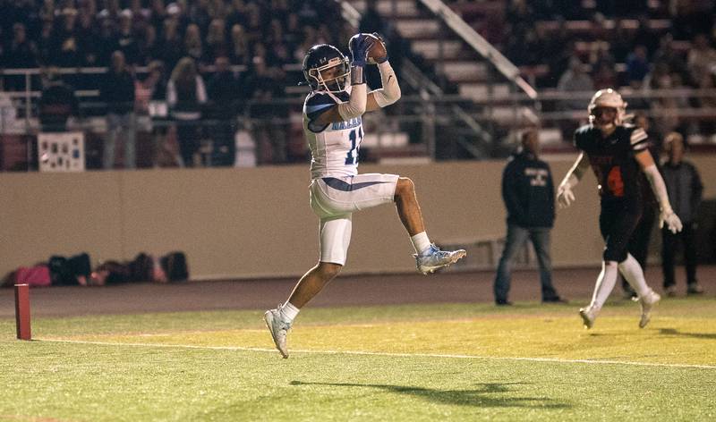 Nazareth Academy's James Penley (11) catches a pass for a touchdown against Benet Academy during a football game at Benedictine University in Lisle on Friday, Oct 21, 2022.