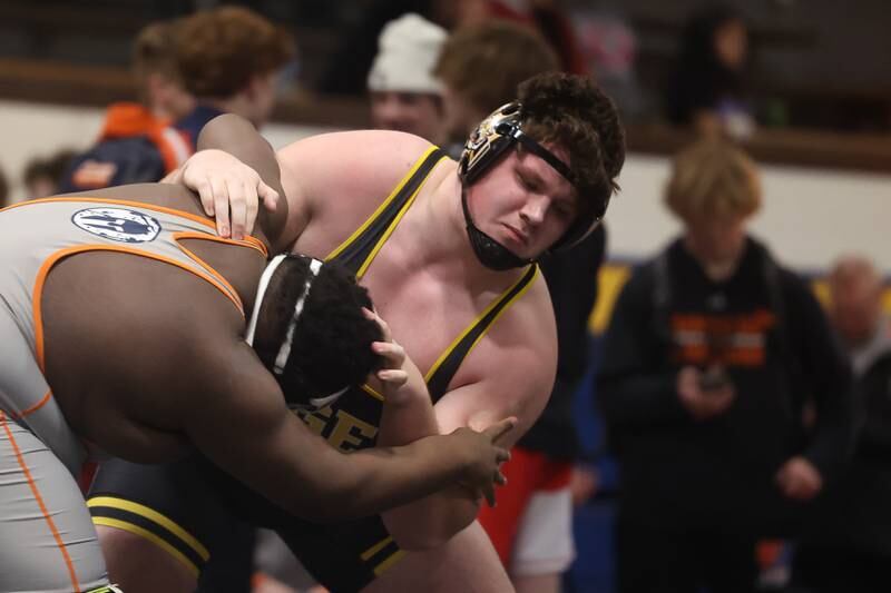 Joliet West’s Wyatt Schmitt looks to bring down Romeoville’s Jamir Thomas in the Southwest Prairie Conference 285 pound Championship at Joliet Central on Saturday, Jan. 20th, 2024.