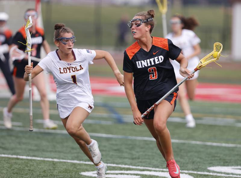 Crystal Lake Central Coop's Fiona Lemke (9) looks for an outlet during the lacrosse state semi-final match between Crystal Lake Central and Loyola Academy on Thursday, June 5, 2025 in Hinsdale.