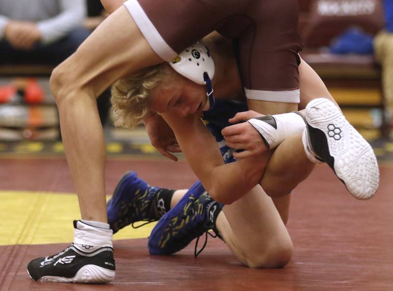 Johnsburg's Eric Bush tries to take down Richmond-Burton's Kristian Gersch during the 113-pound match of a Kishwaukee River Conference wrestling match on Thursday, Jan. 25, 2024, at Richmond-Burton High School.