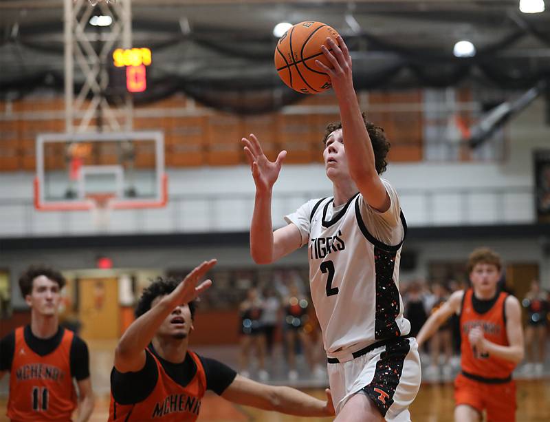 Crystal Lake Central's Danny Spychala shoots the ball in front of McHenry's Adam Anwar (left) during a Fox Valley Conference boys basketball game on Tuesday, February. 10, 2026, at Crystal Lake Central High School.