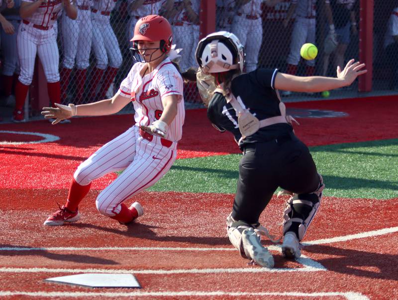Huntley’s Madison Rozanski, right, fields the cutoff throw as Barrington’s Nina Brebach arrives safe at home in IHSA Class 4A Sectional Title Game softball action at the Fields of Dreams on the campus of Barrington High School in Barrington on Friday, June 6, 2025.