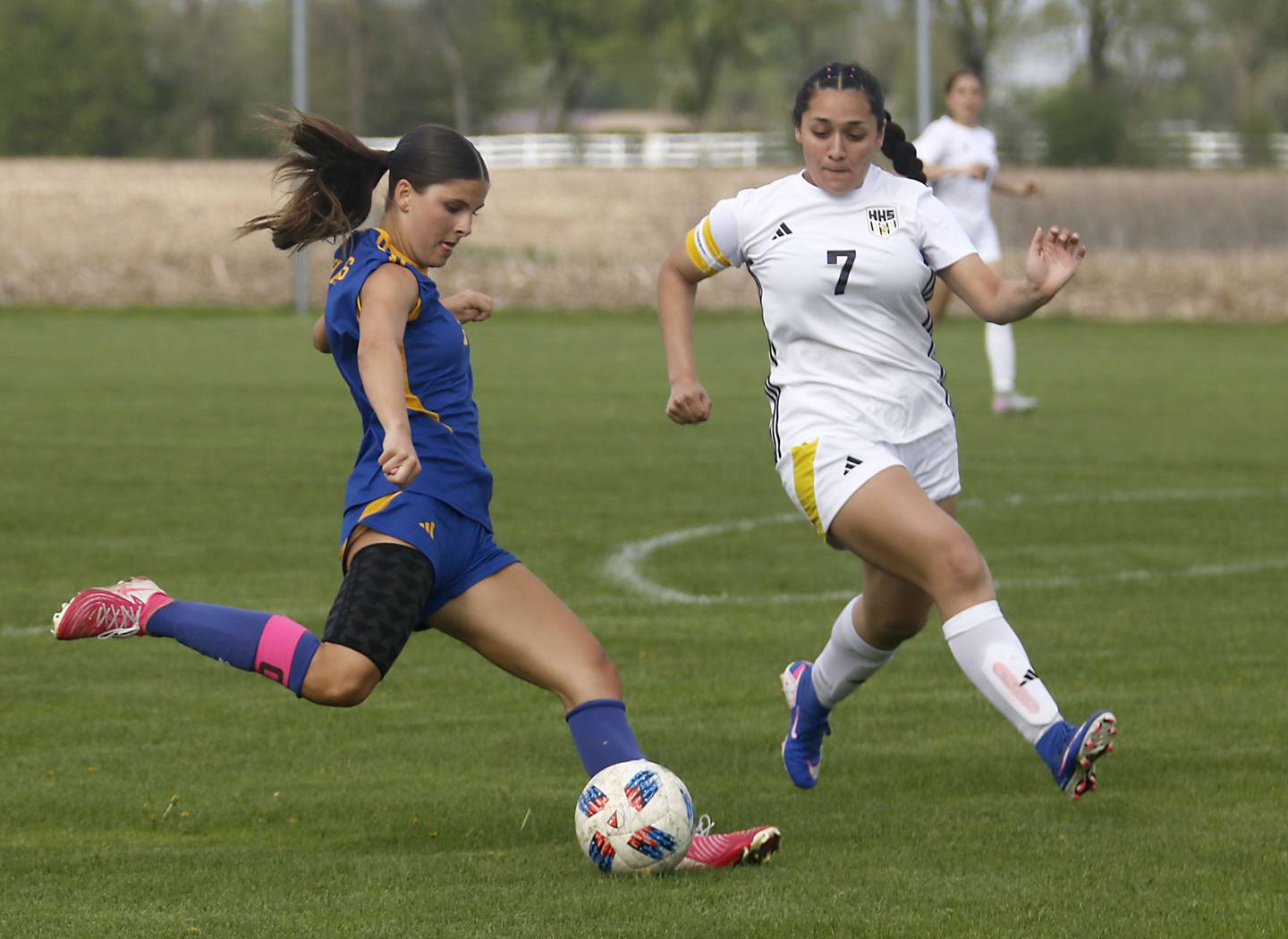 Johnsburg's Elizabeth Smith takes a shot on goal as Harvard's Ithandehui Rosas defends during a Kishwaukee River Conference soccer match on Wednesday, April 27, 2026, at Johnsburg High School.