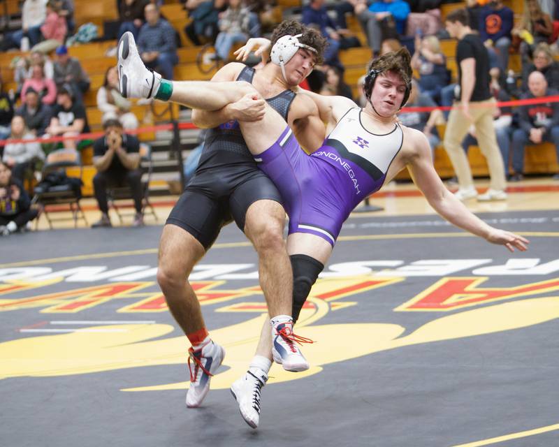 Marmion's Joseph Favia competes against Hononegah's Ethan Ballard in the 215 lb weight class at the Clint Arias Invitational on Saturday, Jan.18,2025 in Batavia.