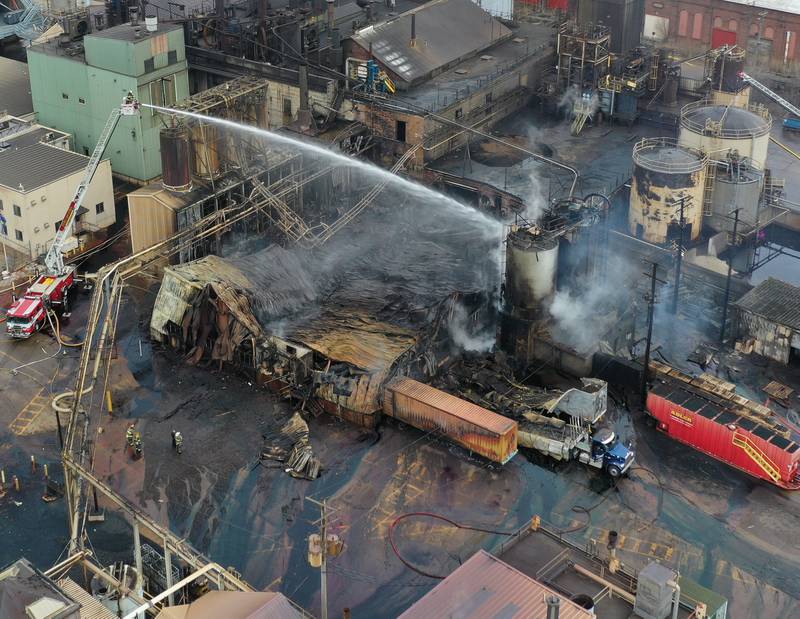 Firefighters continue to spray water on a fire at the Carus Chemical plant on Wednesday, Jan. 11, 2023 in La Salle.