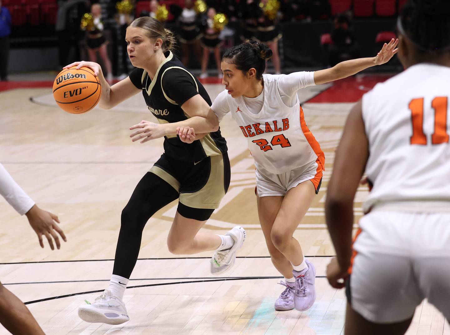 Sycamore's Quinn Carrier drives the lane against DeKalb's Nazeria Dean Friday, Jan. 30, 2026, during their game in the FNBO Challenge in the Convocation Center at Northern Illinois University in DeKalb.