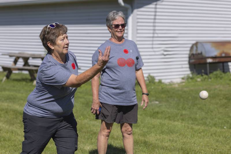 Judy McCauley throws out the pallino to start the practice match before the Chuck Rolinski's Labor Day Bocce Tournament in  Toluca on September 1, 2024.