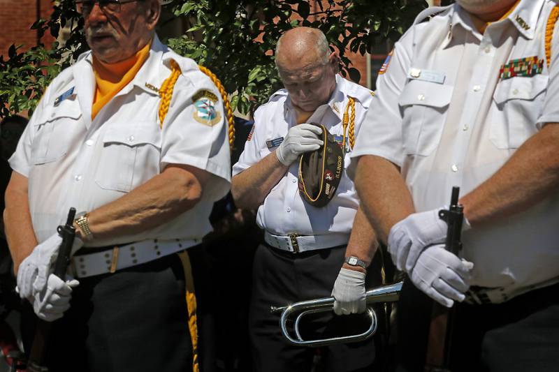 John Widmayer, of Woodstock VFW Post 5040, bows his head during the closing prayer during the Woodstock VFW Post 5040 City Square Memorial Day Ceremony and Parade Monday, May 29, 2023, in Woodstock.