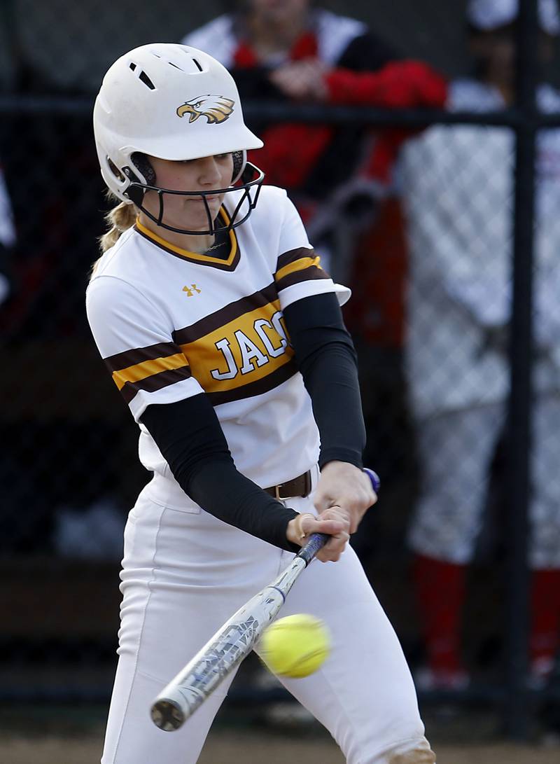 Jacob’s Avarie Lohrmann hits the ball during a non-conference softball game against Palatine Monday, March 20, 2023, at Palatine High School.