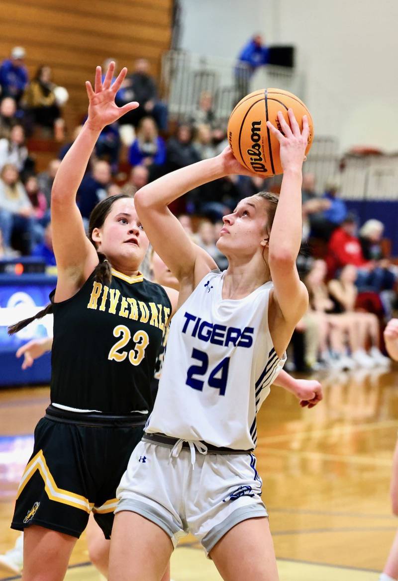 Princeton's Keighley Davis shoots in front of Riverdale's Cayleigh Murray Tuesday night at Prouty Gym.
