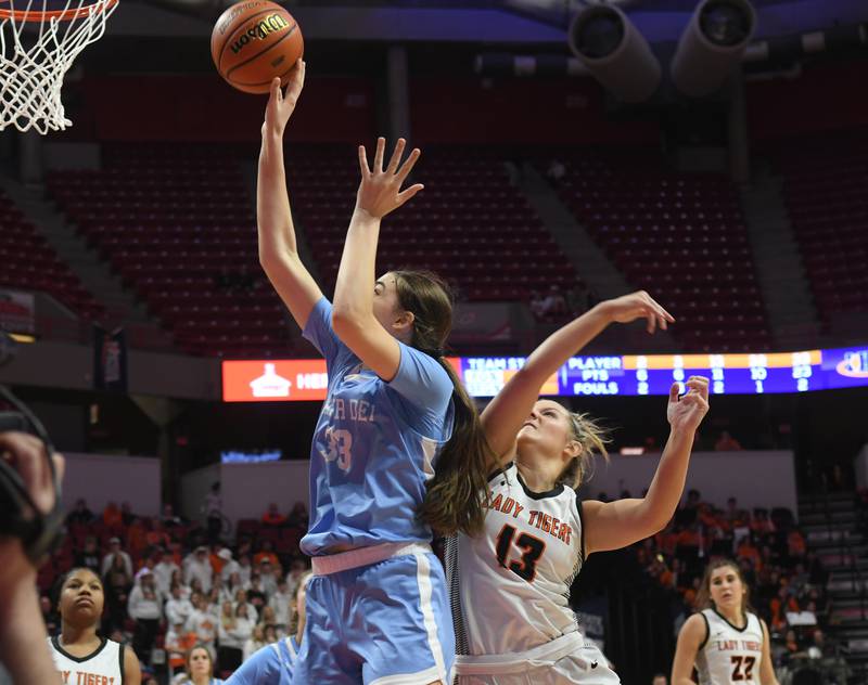 Breese Mater Dei's Alyssa Koerkenmeier (33) shoots as Byron's Ella Grundstrom (13) tries to defend during the 2A championship at Redbird Arena in Normal on Saturday, March 4.