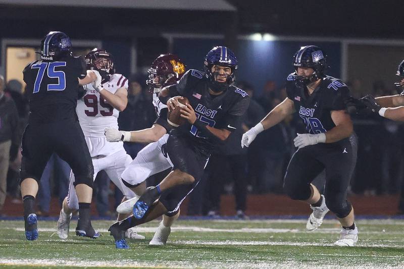 Lincoln-Way East’s Jonas Williams scrambles out of the pocket against Loyola in the Class 8A semifinal on Saturday, Nov. 23, 2024 in Frankfort.
