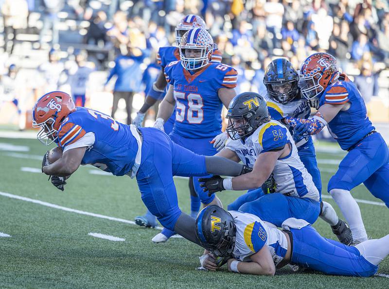 St. Teresa’s Ja’Carrion Jones bulls his way through the defense against Tri-Valley in the class 2A IHSA football state championship game Friday, Nov. 25, 2022.