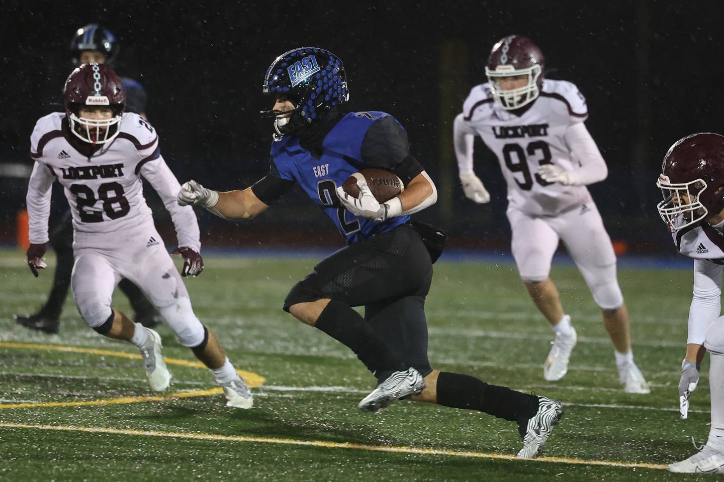 Lincoln-Way East’s James Kwiecinski cuts across the field on a run against Lockport Friday night.