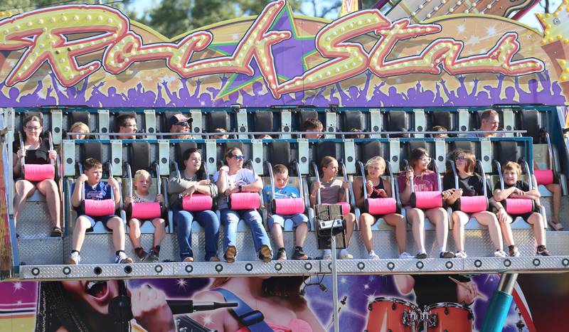 Kids ride the Rockstar carnival ride during the 170th annual Bureau County Fair on Saturday, Aug. 23, 2025 in Princeton.