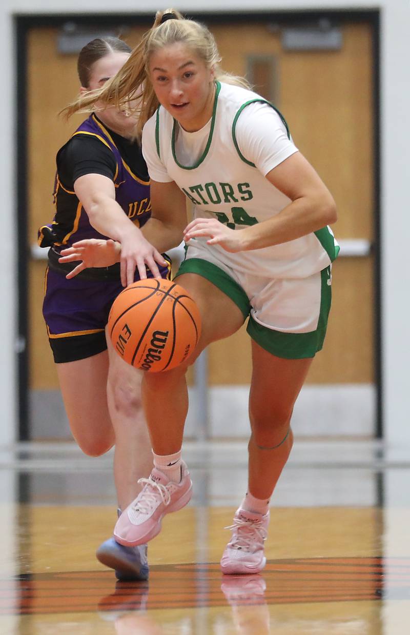 Wauconda's Avery Geoghan fouls Crystal Lake South's Gracey LePage as she tries to steal the ball during the Northern Illinois Holiday Classic Championship girl basketball game on Thursday, Dec. 18, 2025, at McHenry High School.