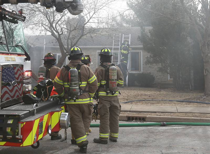 Firefighters respond to the scene of a garage fire in the 1900 block of Shooting Park Road on Monday, Feb. 9, 2026 in Peru. La Salle, Peru, Utica, Oglesby and Spring Valley fire departments were dispatched around 12:15p.m. to the fire.