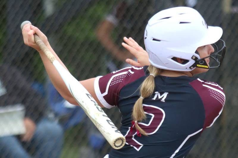 Marengo’s Ellie White connects against Aurora Central Catholic in varsity girls softball IHSA Class 2A Regional Title Game action on Friday, May 22, 2026 at Raymond Benoy Field on the campus of Marian Central High School in Woodstock.
