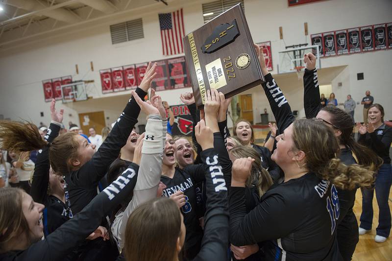 The Newman Comets celebrate their straight sets victory  Wednesday, Nov. 2, 2022 in the sectional championship game against River Ridge. The Comets will play for a chance to go to state on Friday.