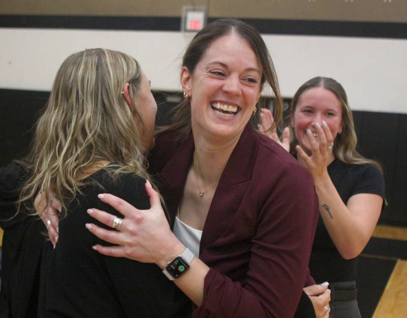 Prairie Ridge’s Head Coach Leah Groat soaks in the moment with her coaching staff after the Wolves won against St. Viator in IHSA Class 3A Super-Sectional girls volleyball at Streamwood High School in Streamwood on Monday, November 10, 2025.