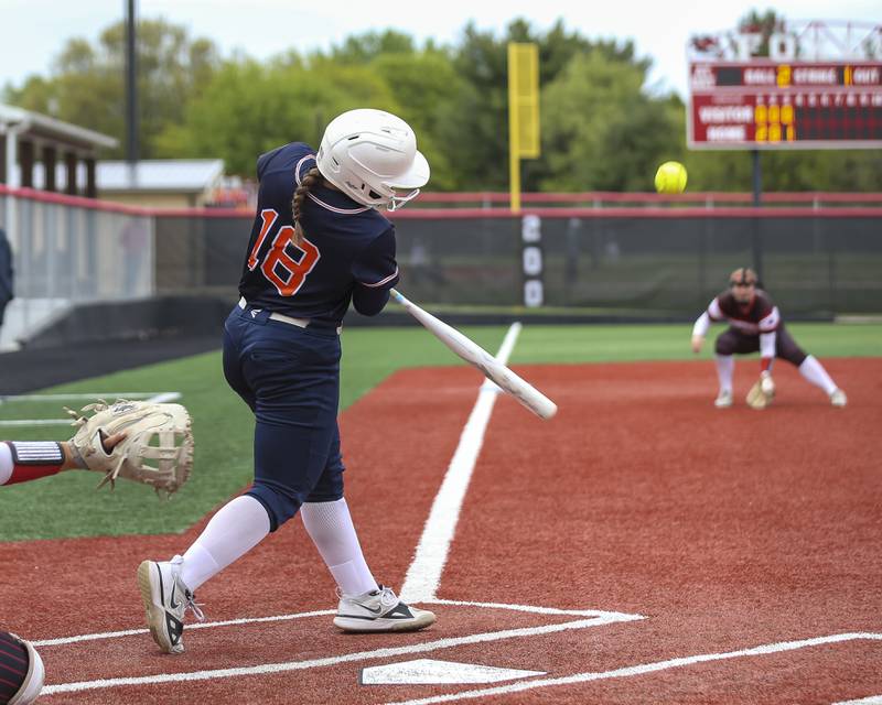 Oswego's Leah McKenzie (18) launches a fly ball to left during softball game between Oswego at Yorkville. May 5, 2026 in Yorkville.