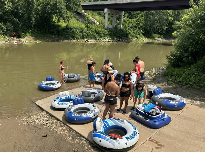 A group of rafters with River Bum Rafting begin to adventure out to cool off in the heat on the Vermilion River on Monday, July 15, 2024 at the boat launch in Oglesby.