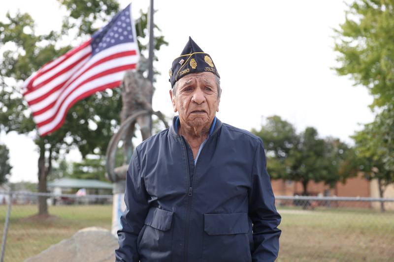 Veteran Joe Belman stands by the Sator Sanches statue at the corner of Collins and Ohio Street on Friday, Sept. 27, 2024.