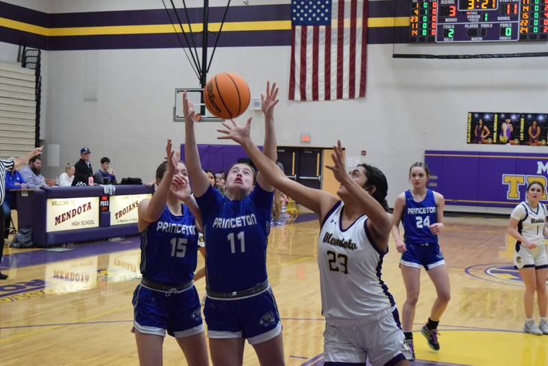 Princeton's Makayla Hecht pulls down a rebound over Mendota's Cassie Gonzalez at Mendota on Thursday. The Tigresses won 65-28.