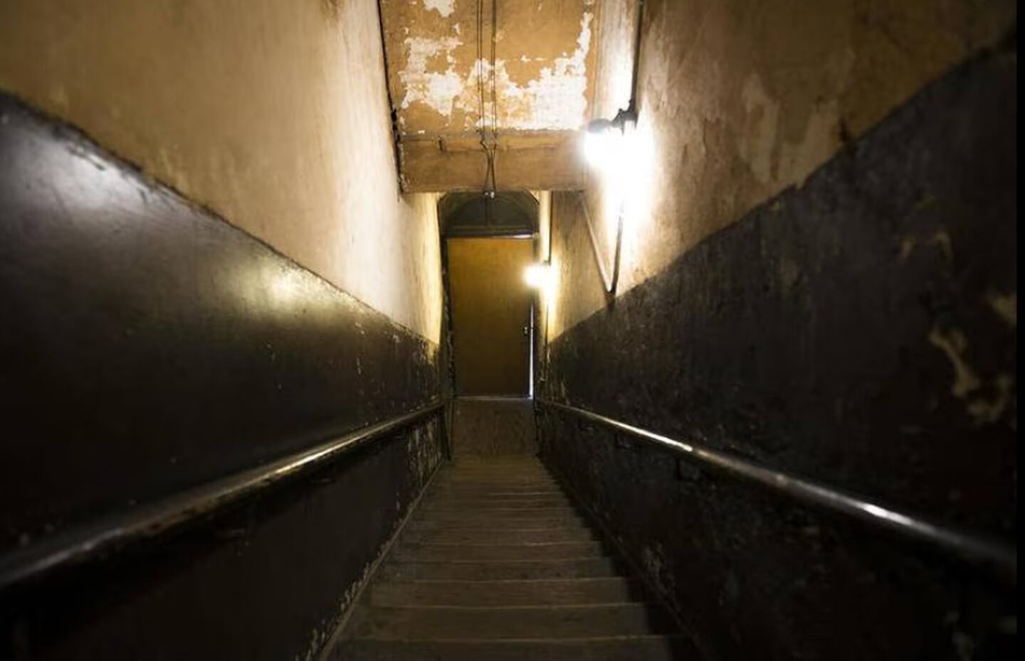 The spooky staircase between floors at the Amboy Thrift Store, leads to an upstairs apartment, where a tenant reported hearing the sounds of children running up and down the stairs all of the time.
