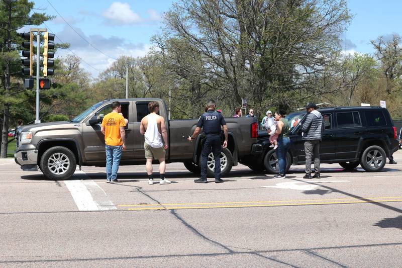 A car crash occurred in front of protesters on Sycamore Road Saturday, May 3, 2025, at the entrance to Hopkins Park in DeKalb during a May Day Rally for Democracy to protest against Trump administration policies.